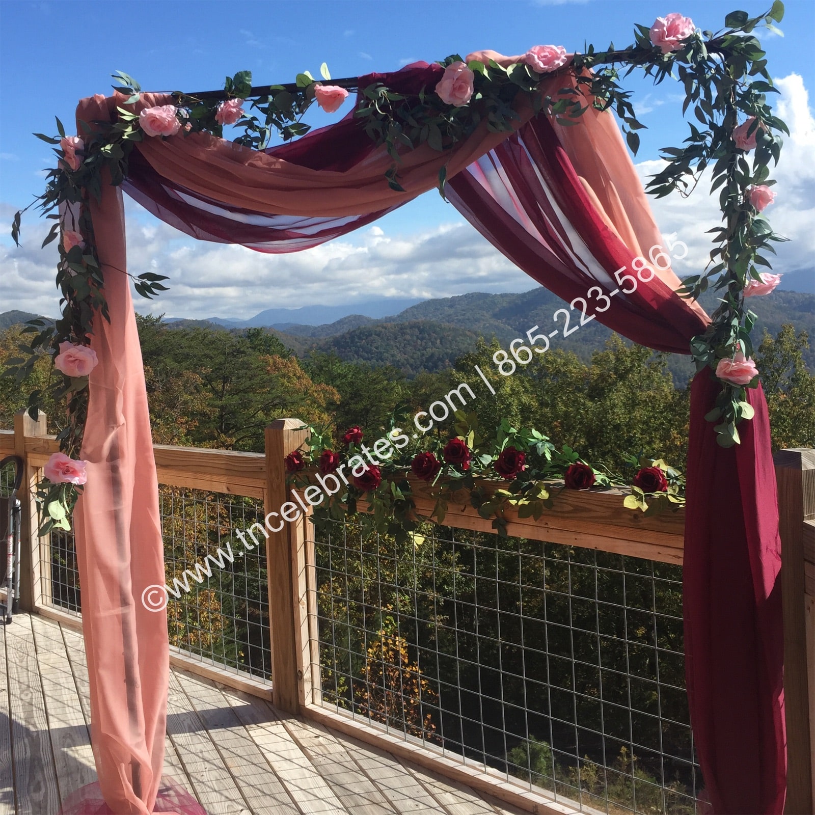 Draped floral arch for a cabin wedding with great views of the Smoky Mountains