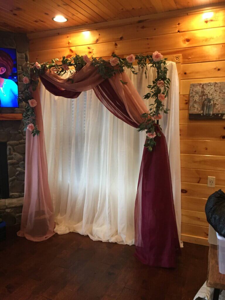 floral archway with draping